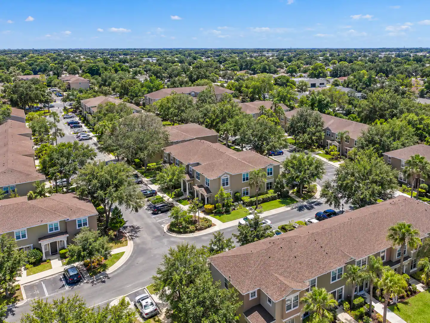 Example drone photo: aerial view of a townhome community, annotated “Disney 20 mins away” and “subject”